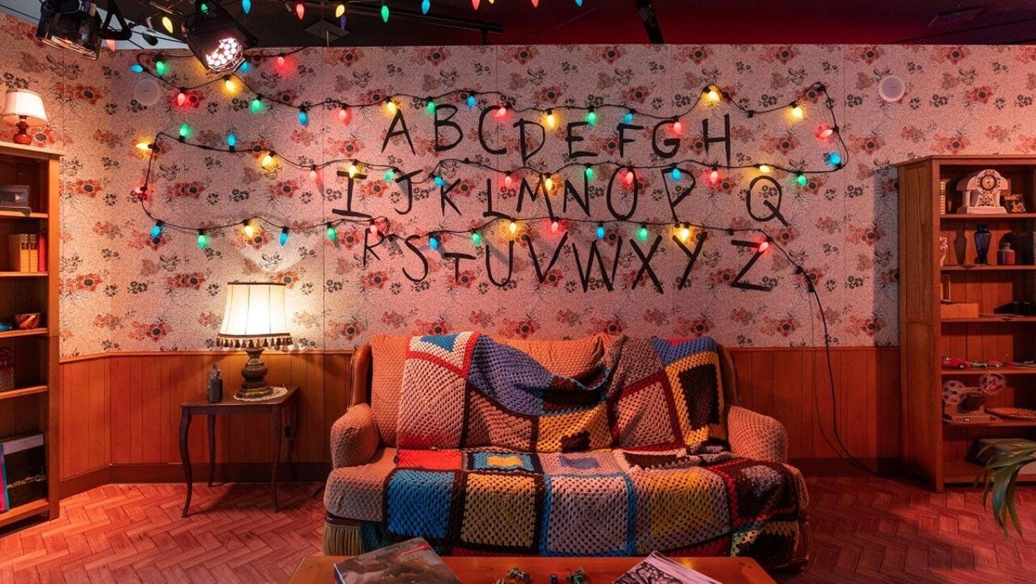 Image of the Milan pop-up store featuring a sofa and Christmas lights from the Byers&rsquo; house