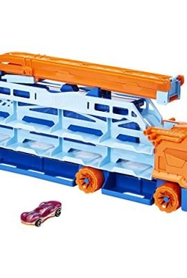 Hot Wheels - Free-Fall Car Carrier, featuring 1 race car and over 20 vehicles in 1:64 scale, transforms into a 60 cm high-speed track—perfect for kids aged 4+! HDY92